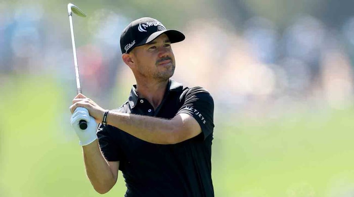 Brian Harman is pictured watching a shot during the final round of the 2024 Players Championship at TPC Sawgrass in Ponte Vedra Beach, Fla.